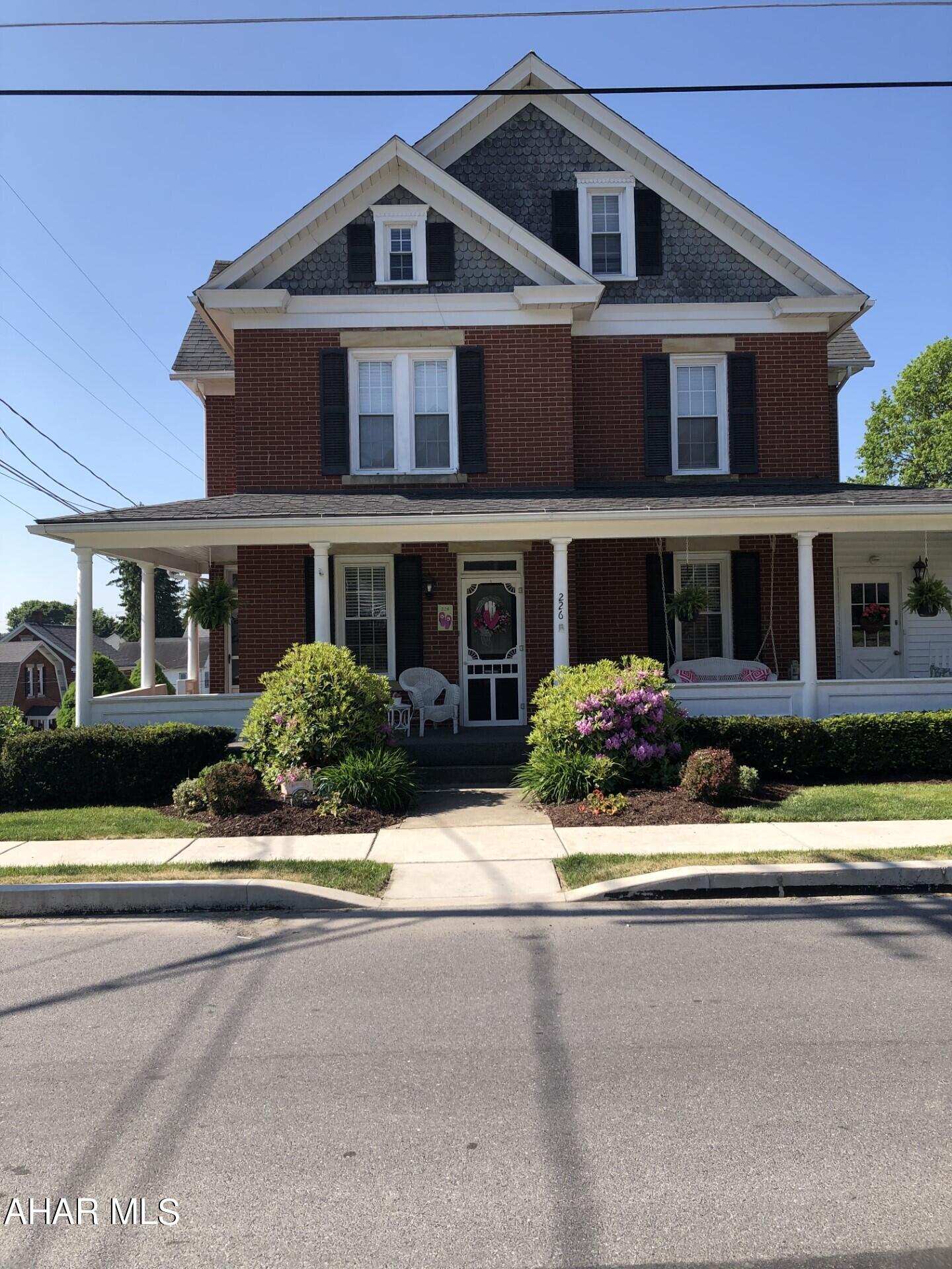 Ebensburg- Stately 2 1/2 story, 4 bedroom, 2 1/2 bath brick home on corner lot.  This home is full of character with hardwood floors, pocket doors, wainscot, and many other features.  Gas, Hot water heat.  200 amp service, 2 Car Carport that could be used for entertaining.  Cement pad for RV.  Newer roof.  Attic could be 5th BR or office.  Well maintained home.