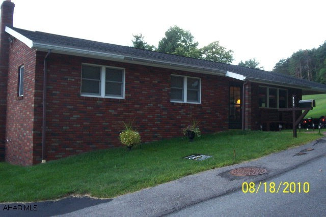 3 bedroom brick ranch, 1 1/2 baths, large porch and deck with scenic view of Northern Cambria
