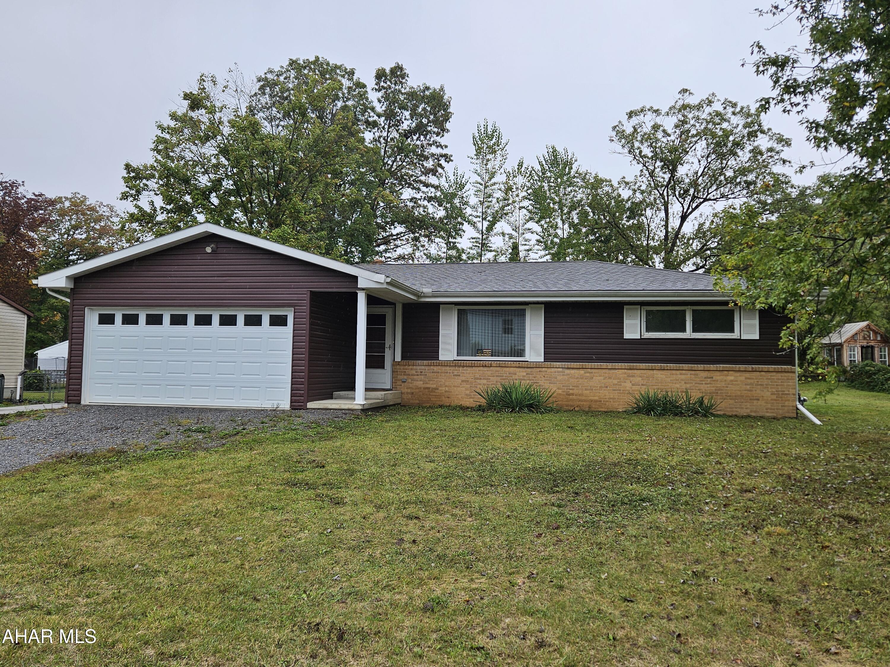 Charming 1970 Ranch in a highly desired area! This well-maintained home features beautiful hardwood floors throughout and a brand-new master bathroom for modern comfort and accessibility.  The home offers a lot of ADA compliant features.  A huge basement, high ceiling basement awaits your vision to finish and double the living space!  The oversized one-car garage provides plenty of space for parking and storage. Enjoy the large yard—perfect for gardening, entertaining, or simply relaxing outdoors. A rare find in a sought-after neighborhood, this home blends classic ranch style with thoughtful updates.