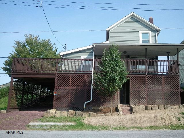 This home was gutted to the studs and completely redone. New roof, new windows, new siding, rebuilt deck, wrap-around porch, new drywall, new laminate and tile flooring, new kitchen, stainless steel appliances, new bathroom, new light fixtures, etc. Driveway is made with landscaping stones. Move-in ready.
