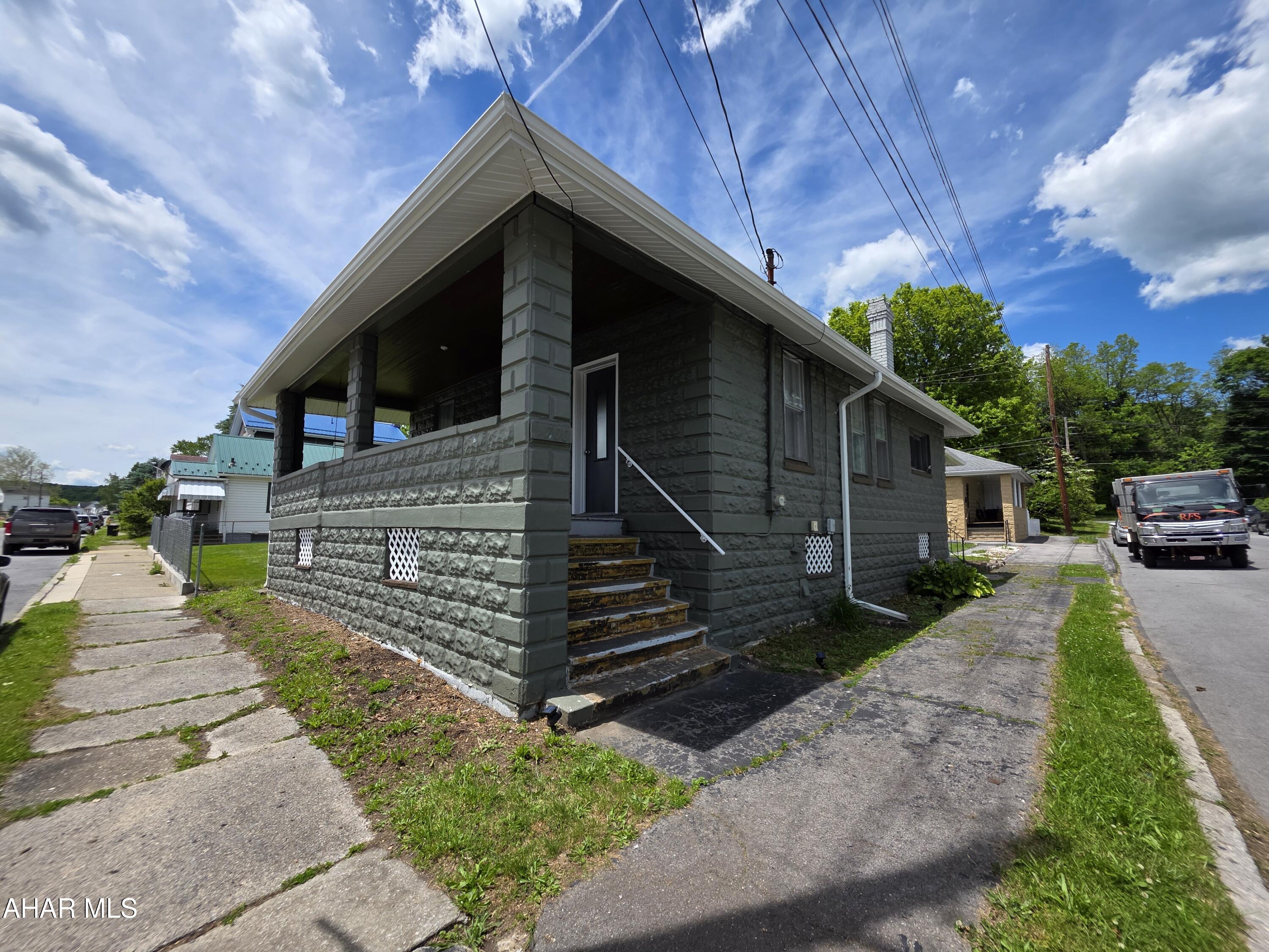 Extensively updated 1-bedroom, 1-bath home on a corner lot, featuring numerous recent improvements throughout. A covered front porch welcomes you into a bright, open living space with updated flooring, fresh paint, updated lighting, and a redesigned layout that creates an open-concept living and kitchen area. The spacious bedroom offers plenty of room to relax, while the remodeled bathroom and updated kitchen provide modern functionality. Recent improvements include drywall, electrical upgrades, kitchen cabinetry and countertops, flooring, trim, lighting, ceiling fans, bathroom updates, and fresh interior paint. Exterior improvements include a newer architectural roof (2020), exterior paint (2020), gutters, downspouts, soffit and fascia, Move-in ready and thoughtfully improved, this home offers comfortable living with many major updates already completed. Buyer to confirm taxes, sq. footage and lot size. Call today to schedule your showing.