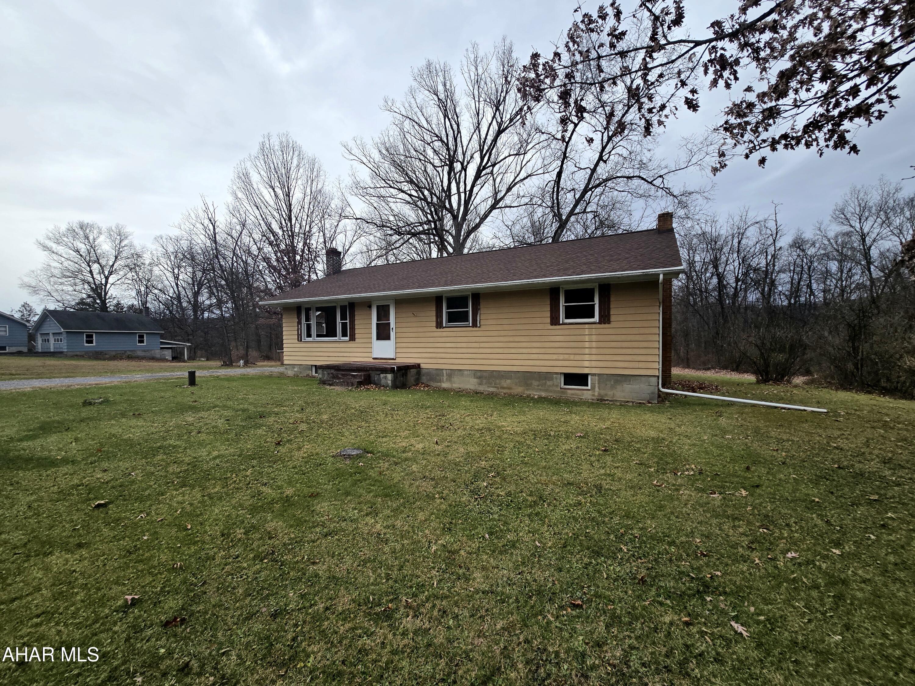 One story living!  Situated on 1.4 acres this 3 bedroom 1 full bath home is a blank canvas waiting for you to make your own.  Walk in the front door to hardwood floors throughout, natural light, and an open concept!  The basement is unfinished with newer furnace and ample storage.  Schedule your private showing today.  Something like this is hard to come by.