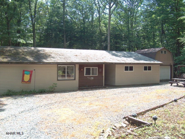 Super nice modified single wide MH with additions & shed on large lot.