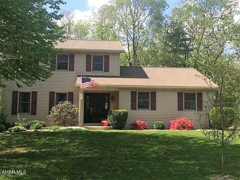 Welcome to this cheerful and inviting 3-bedroom, 2.5-bath home nestled on a gorgeous wooded lot in the desirable Mountain Laurel Court neighborhood. The kitchen boasts newer stainless steel appliances and ceramic tile flooring. Enjoy a spacious master suite complete with a private bath and walk-in closet. Surrounded by mature trees, the property offers complete privacy—relax on the covered deck and new patio while watching deer and other local wildlife.