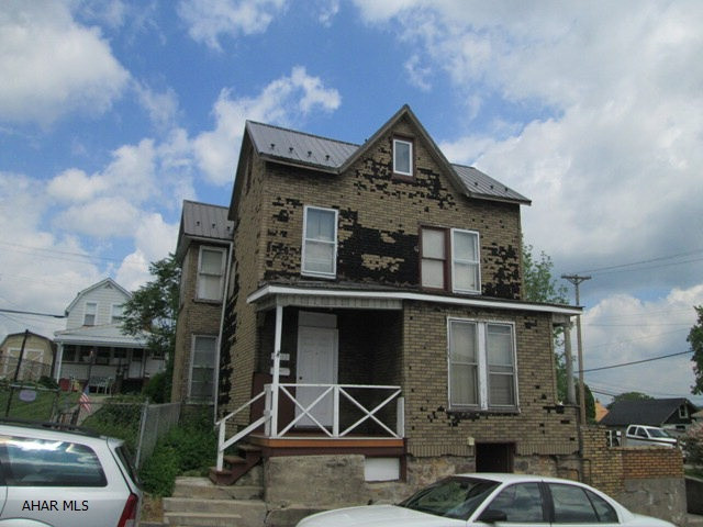 Drive-bys will not work on this duplex.  This house features 2 new baths, new roof, 2 newer hot water tanks and a newer furnace.  The exterior work that is needed is reflected in the discounted price.  Check the interior photos.