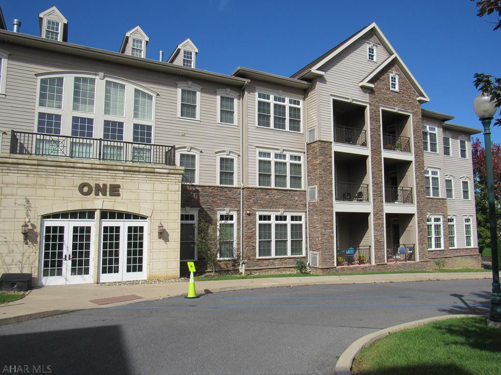 Wake up to the sunrise over Mt Nittany in this bright & spacious condo. A rare opportunity to own a TOP-FLOOR CORNER unit that has been meticulously maintained. Step into the tiled entryway & gourmet kitchen complete with granite counters, Bosch stainless appliances & endless cabinet space. Enjoy the open concept living room with 10' tray ceiling bordered by crown molding & an expansive bank of windows. Peer over the mountainside from your private covered patio. Master bedroom is complete with a large walk in closet & luxurious bathroom with soaking tub & tiled shower. Your guests will have the privacy of their own full bathroom. Unwind in the clubhouse complete with indoor pool, hot tub, sauna, steam room & gym or book the lounge for a larger gathering of family & friends. One reserved p
