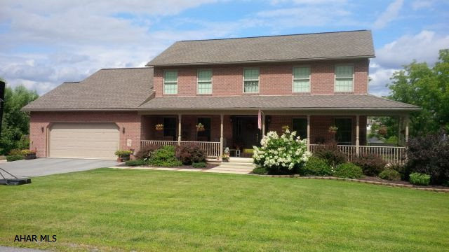 Beautiful well kept home in a quiet area of Hollidaysburg. Plenty of room for the growing family with 4 bedrooms, 3.5 baths, master suite with lovely bath and walk in closet, kitchen with granite counters, maple cabinets, ceramic back splash and tile floors. The dining room is large enough to host family dinners and the family room has 13' vaulted ceilings. The finished walkout basement has a fireplace and 3/4 bath, plenty of storage and a workshop for Dad. All of this on a beautiful 1 acre lot with great outdoor space with a wrap around porch, deck, patio and fire pit and a view. Electric heat pump with oil back up. Average electric bill $200 year round. Fireplace is propane. With summer coming, you will love this beautifully landscaped one acre lot!