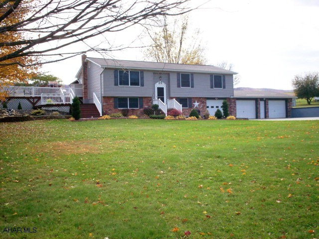 This beautifully landscaped home is one of a kind! It comes complete with a small water pond within the landscaping itself and various fruit trees. The exterior is partial brick and vinyl siding with a large 3 car attached garage. If you like to entertain, you will have a choice to make. You can use either the nicely sized rec room downstairs, complete with a coal burning pellet stove(2 ton of pellets included)or the two-tier deck (newly stained)in the rear of the home. There is also an above ground pool and matching outside shed(23' x 13').  This property sits on a 1 acre parcel located in Snake Spring Township, only minutes from both Bedford and Everett,PA. (Bedford Area Schools).