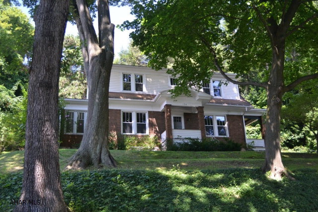 Classic 2 story, 3 bedroom, 1.5 bath with all the original detailing in great condition.  Hardwood flooring, mosaic tile entryway, subway tile in bathroom & kitchen, all insulated windows, wood burning fireplace, and much more.  Detached 2 car garage built in 2003, windows replaced in 2001, landscape blocks in 2007.  Add your own decorating style to make this home your own.