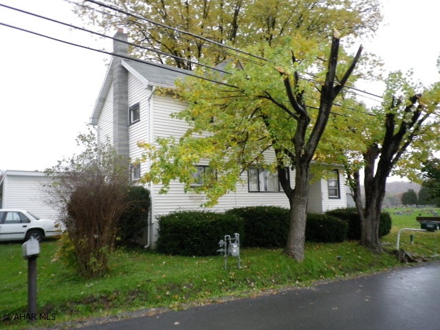 Country living next to town.  Older home in need of some TLC to make it your own.  Nice kit with laundry area.  Enclosed front porch.  Large open area on second floor could be redone to make larger bedroom.  New furnace in 2010.  Neighbor has reserved right of way for driveway on back of property.