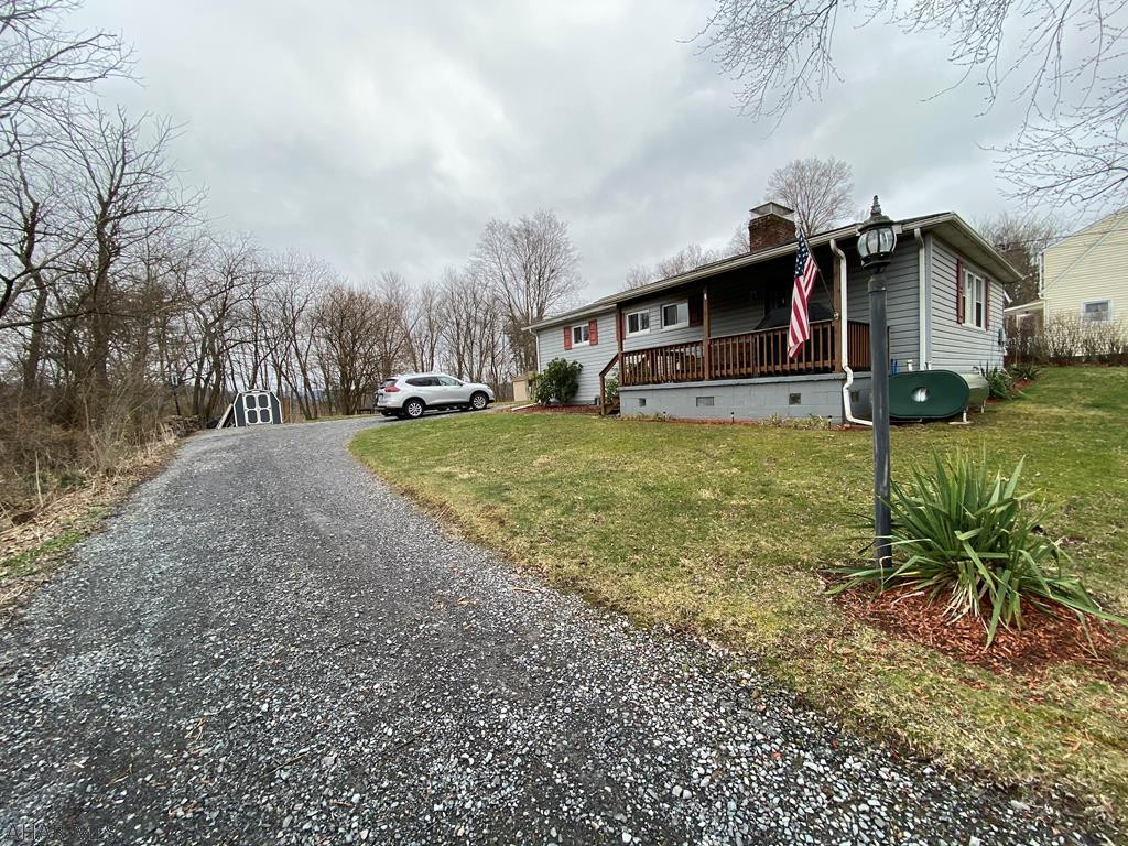 Beautifully updated home located just outside downtown Bedford. Centrally located with easy access to I-99, I-76, I-70 and Rt. 30.   Original hardwood floors in the Livingroom, Ceramic tile kitchen floors,  wood burning fireplace in the living room,. Large family room in the basement.  Spacious Flat  .51 acers. this home is a must see. Call today for your private showing