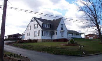 cape cod Nicelt remodeled cap cod home with oak kitchen, four car detached garage, and shed with pavillion.
