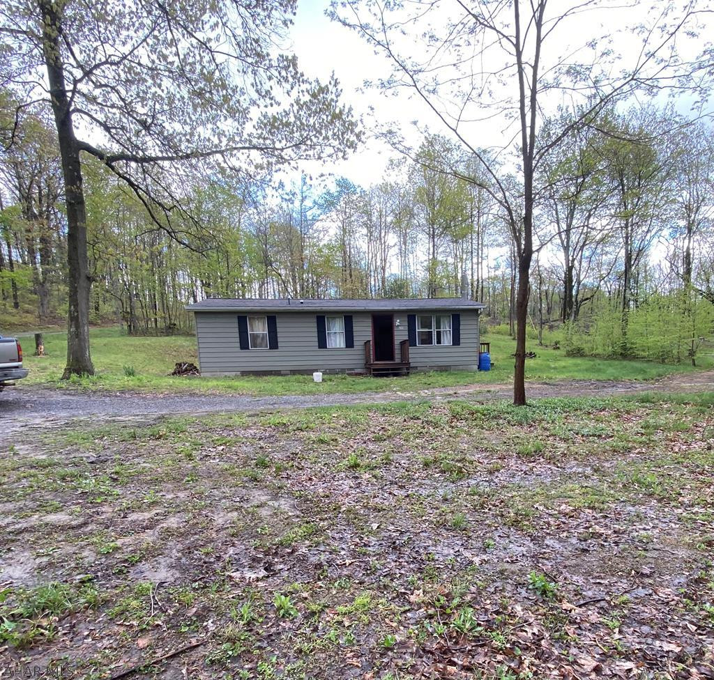 Wow... what a price!  1 acre lot, septic, water and 3 bedroom 2 bath home within a 5 minute drive of the Pennsylvania Turnpike, Interstate 70 and Lincoln Highway.  Adjacent to Buchanan State Game Lands makes this a bargain.  The present owners started the restoration of this home by removing floor joist, flooring and overall renovations but is unable to continue.  Paint and flooring could transform this home.  All new windows are in wait of installation.  A newer roof, new shed, windows and well pump add to the value.  Don't wait, it won't last long!  School District: Oakgrove School.  All new replacement windows.
