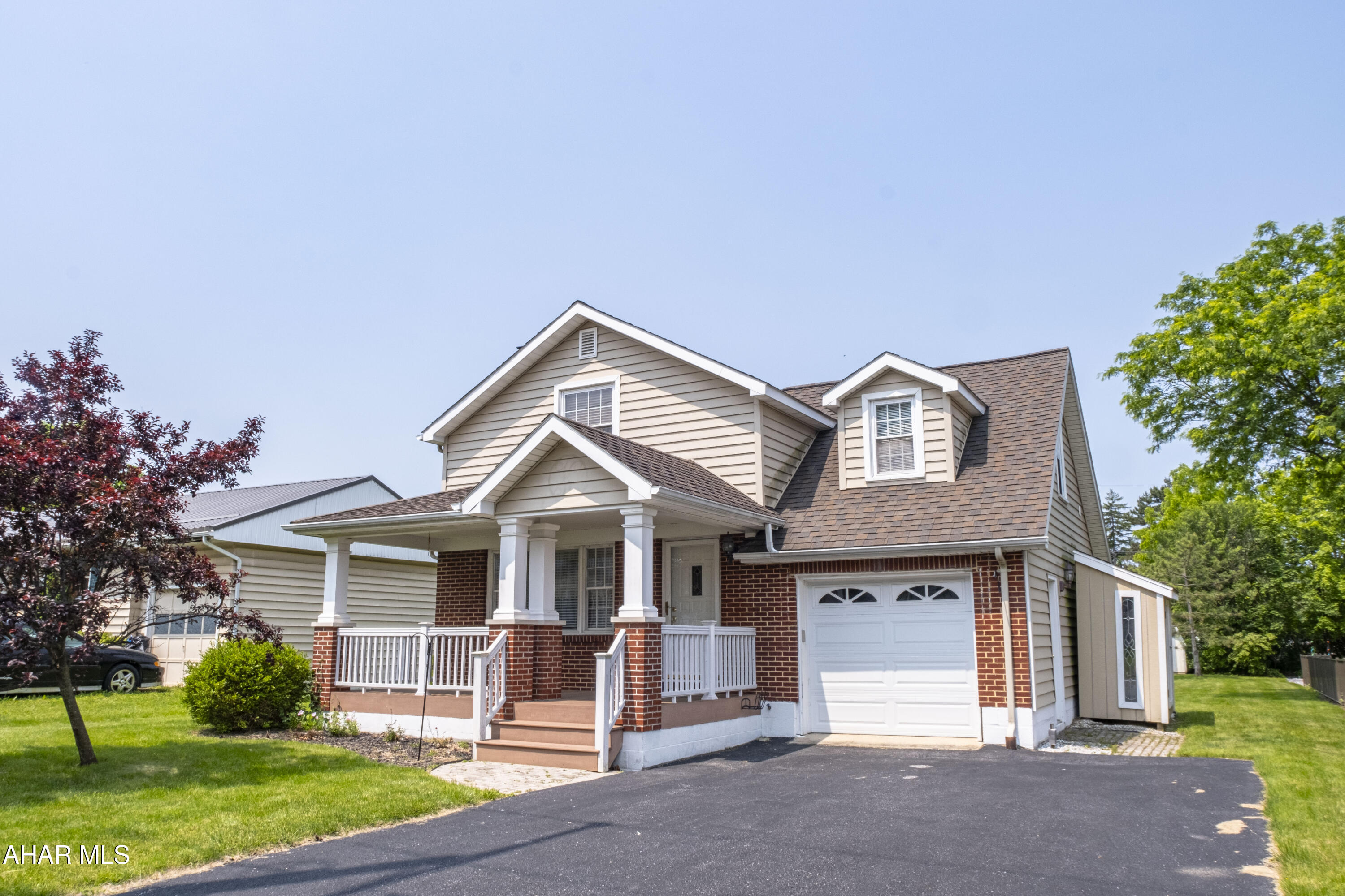 Located in a highly desirable area of Hollidaysburg Borough, this charming and well-maintained 3-bedroom, 2-bath home sits on a large, level lot with plenty of outdoor space! Inside, you'll find hardwood floors, a gas fireplace in the living room, and a modern kitchen offering ample cabinet space and excellent storage. All three bedrooms are generously sized, providing comfortable living space throughout.
Additional highlights include a covered front porch, a rear deck equipped with an electric awning—perfect for outdoor enjoyment in any weather—and a 1-car garage. A full, unfinished basement provides valuable storage space and potential for future expansion.
