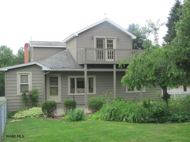 Country Craftsman home with wide oak trim, oak hardwood floors, oak boxing on the ceiling, oak colonnade and lots of stained glass. Newer furnace and windows. Dining room and living room are open and inviting with oak boxing. 4th bedroom makes a great office area. Large fenced back yard. 2nd floor suite is very private with private deck that overlooks farmlands and mountains. 2nd floor suite has 8X10 walk-in closet, full bath and new carpet newly installed for listing. 1st floor bath was remodeled in 2005 with jacuzzi bath.