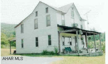 Farm house, 6BR/2 full BA, eighty acres. The buyer will take a few acres at the bottom of the road to place a trailor for her to live.