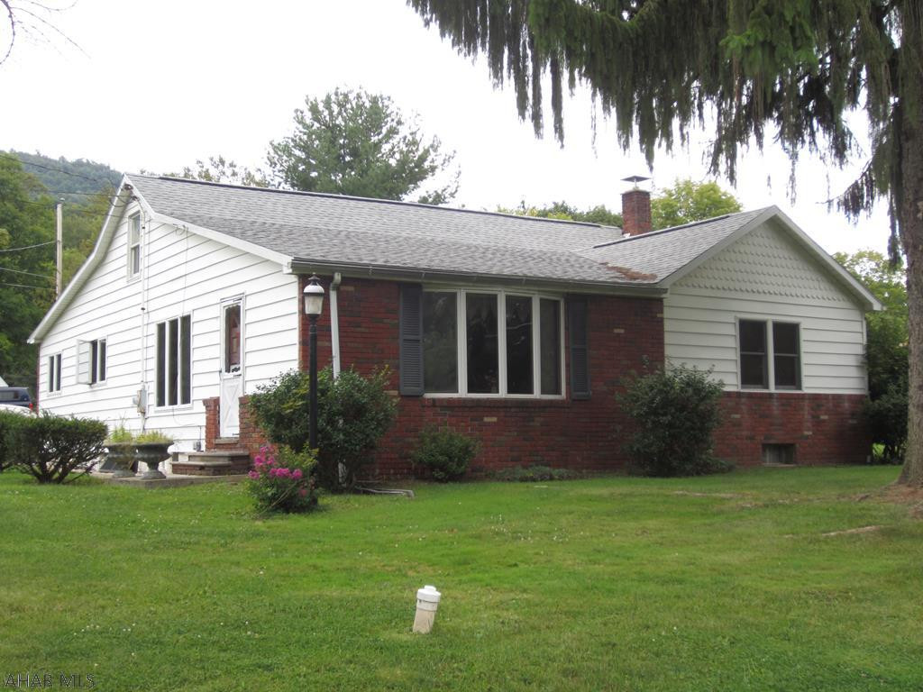 In a nice quiet country location with .59 acres, this property has much to offer. The 3 bedroom, 1 bath ranch home gives you 1 floor loving with lots of open space outside in a peaceful neighborhood. The open kitchen and dining room flow right into a large living room with oak hardwood flooring. The 3 bedrooms all have new carpet and hot water base is the heat. The exterior is brick and vinyl siding with a brand new roof in 2018. The over sized 2 car garage has a 2 bedroom apartment for potential added income. Storage sheds and extra storage. Buyer to confirm square footage and taxes.
