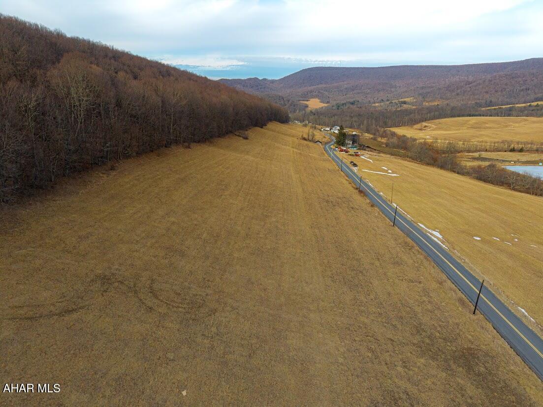 This amazing 19.95 acres of land offers stunning views of the mountains.  Building  your dream home or just a get-away retreat, possibilities are endless. This property is a perfect blend of open fields and wooded area offering a mix of oak trees. Over 5 acres of tillable land. Abundance of wildlife for the outdoor enthusiasts awaits those avid hunters or just for your recreational pleasure. The PA State Games Lands of 11,000 can be seen  from the scenic views from this property!! This property offers it all!!