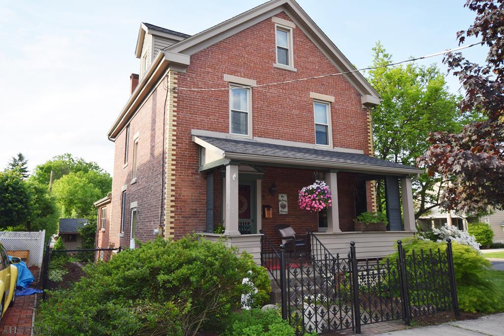 This classic 2.5 story brick home is celebrating it's 100th year anniversary of adorning the corner of Hickory and Jones Streets in Hollidaysburg Borough!  Beautifully decorated and maintained, this home is the perfect example of modern upgrading while keeping the integrity and character of the original home.  You will feel at home the minute you walk in the door.  Formal living room and dining room, modern eat-in kitchen, family room with gorgeous brick gas FP and half bath.   The outdoor living space begs you to entertain.  Sliding doors from the family room take you to an open porch with steps down to a spacious  new paver patio.  The yard has a vegetable garden, grape arbor, apple tree, fire pit, and the cutest tool shed you've ever seen!  What a find in the borough!!