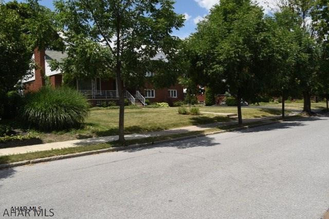 Beautiful, large, custom built, brick home, on a quiet street in Columbia Park area. Five finished levels of living space (3668 Sq. Ft.)!! Only one owner. Freshly painted, perfect for the growing family. Large rooms, lots of storage and natural light. Gorgeous hardwood floors! Kitchen has brand new appliances and Corian counter tops. Ceramic tile floors. Two kitchens, two family rooms and two fireplaces! Living room fireplace is Lime Stone. Den/Office could be 5th bedroom. Workshop. Large sun room with Jenn Air Grill. The property is professionally landscaped with a Lime Stone wall and fireplace for outside entertaining. Large concrete driveway and 2 car carport. Large front porch is perfect for relaxing on quiet evenings. You've got to see this house...its one of a kind! Taxes are est.
