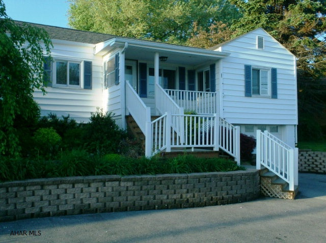 Cozy 2 BR maintenance free ranch home with central air & garage.  Private vinyl fenced back yard with lighted pavilion, beautifully landscaped. House has been insulated in attic and walls. HOME WARRANTY INCLUDED!