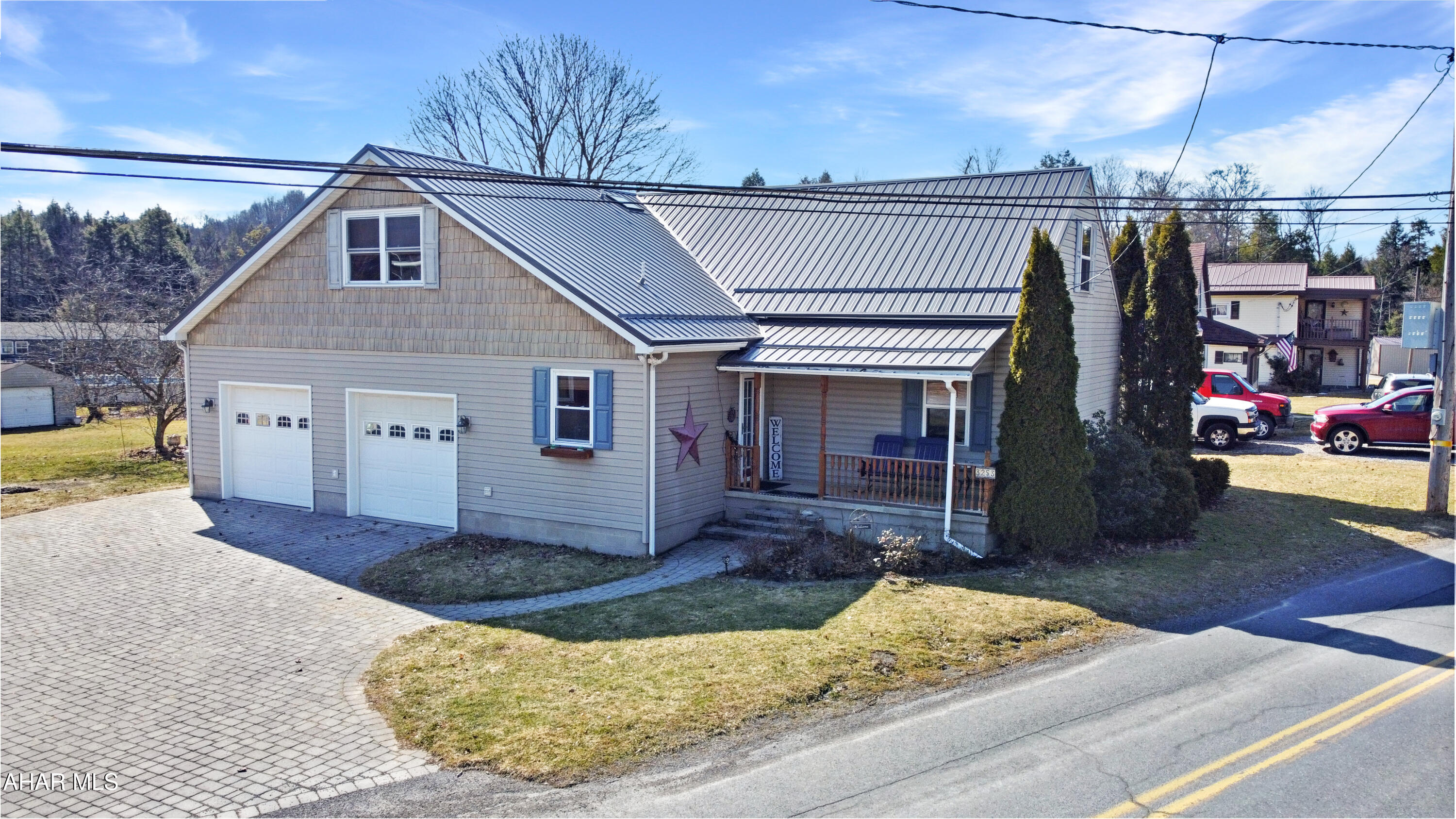 Welcome to 3235 Benshoff Hill Road, located in the Central Cambria School Districts, Jackson Township. This stunning home is deceptively spacious, offering much more room than it appears from the street. Recent updates enhance its appeal, including a brand new metal roof complete w/ a lifetime guarantee. Upon entering the main floor, you will be welcomed by a generous foyer leading to a large half bathroom w/ laundry. The layout features a cozy sitting room, a beautifully appointed kitchen w/ an island & ample cabinetry, a dining room, a formal living area, & an expansive family room w/ a propane fireplace & sliding glass doors that open to the rear patio, perfect for entertaining. Upstairs, you'll find a full bathroom, three spacious bedrooms w/ abundant closet space, & a luxurious master suite that boasts two walk-in closets & a sizable en suite bathroom. Additionally, the upper level includes a versatile bonus room that can serve as an office or a fifth bedroom. The unfinished basement provides excellent storage solutions, while the exterior is equally impressive. It features a large paver driveway, a welcoming covered front porch, an oversized heated two-car attached garage, a detached garage/shed, a picturesque paver patio w/ a gazebo, & a sprawling yard, offering endless possibilities for outdoor enjoyment. Call today!