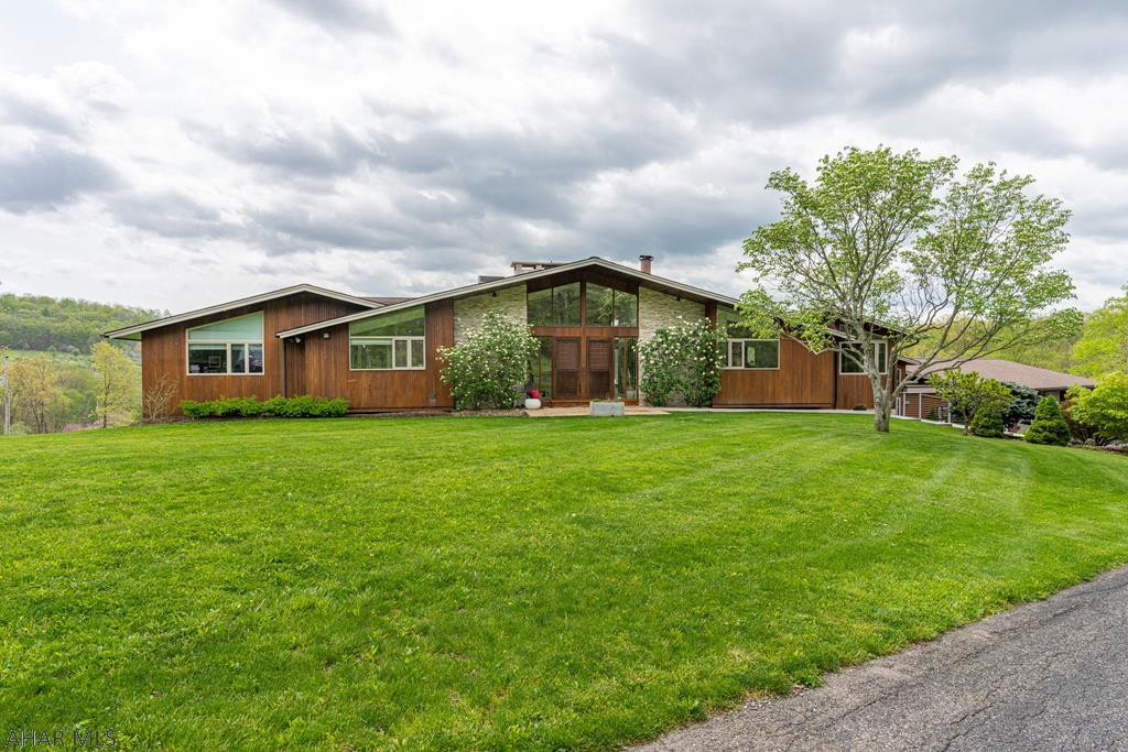 This Luxurious Contemporary Masterpiece in Scotch Valley offers seclusion and tranquility.  Nothing was spared in the building of this nearly 7500 Sq Ft residence, which sits on over 9 acres with sweeping views through an abundant amount of massive windows. Glass sliders line the hardwood and stone floors both up and down.   The private master suite features a substantial walk-in closet and indulgent master bath with step in shower, soaking tub and double sink.  The impressive home contains 7 bedrooms, 3 full baths, 2 half baths.