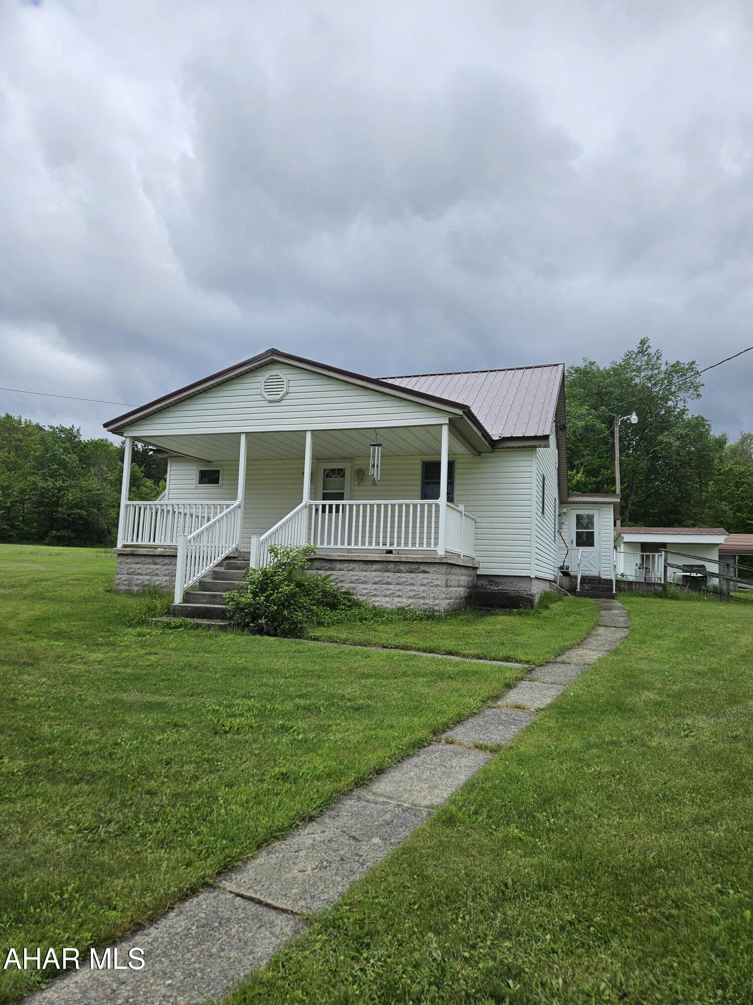 This property features a charming home with an eat in kitchen, dinning room, living room, full bathroom and master bedroom on the first floor. the second floor has 2 spacious bedrooms. Set on 9.6 acres, this property also includes a very spacious 3 bay garage with a separate well for added convenience. 
Call to schedule your showing today.