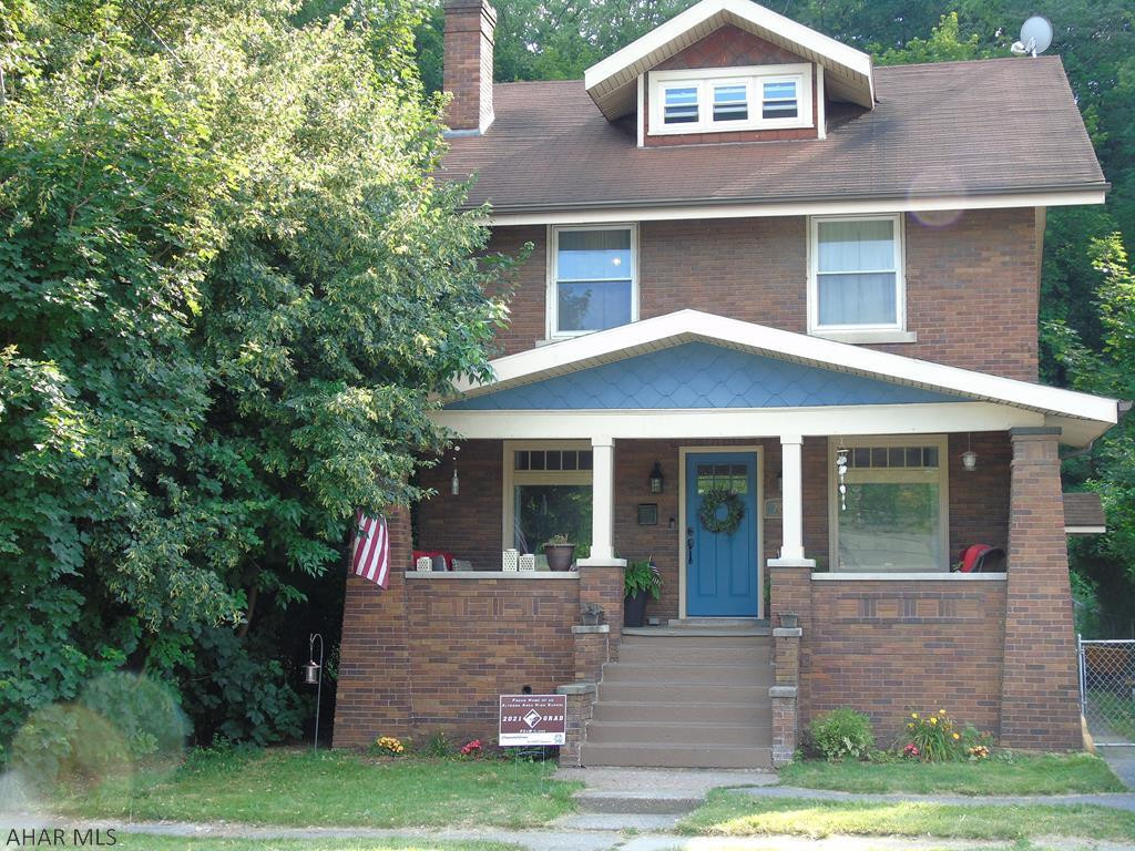 **Brick Beauty** Looking for the perfect home for your family?  This large, inviting brick home boasts of 4-5 bedrooms and 2 bathrooms.  This home's character sets it apart from others with it's beautiful hardwood floors, large pictures windows that allow in an abundance of natural light, and a brick, wood burning fireplace with built-in bookshelves. The first floor laundry room is right off of the recently remodeled eat-in-kitchen. Store your shoes and jackets in the lockers located in the mudroom.  This home also offers an office/playroom area!  It has newer windows, a newer furnace, and a newer water heater.  In addition to the off street parking spot in the front of the home, there are two additional parking spots in the back through the alley.