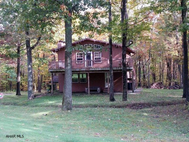 PRICED TO SELL!  Great price for a TRIPLE unit on the golf course!  Enjoy the golf and outdoors in the summer and skiing in the winter!  Beautiful, fully-furnished Blue Knob mountain retreat on 9th tee!  Three separate living areas for each family or for your guests!  Spacious deck, separate electric, 1 fireplace, and 2 woodburners.  Association fee only $300 per year.  J-241