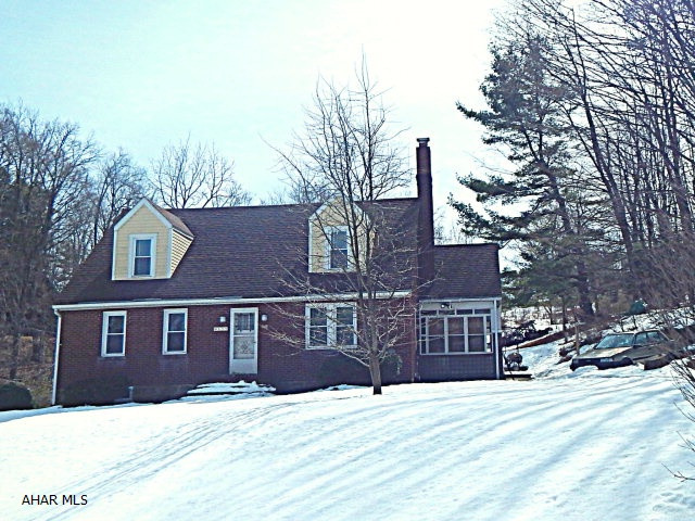 Country living is what you will experience in this 4-5 BR,1 3/4 bath brick & vinyl, bright & cheery, exquisitely maintained home. This home boasts a fireplace, family room, living room, dining room, & a 3 season room situated on a 1 acre lot.  Set your personal tour.