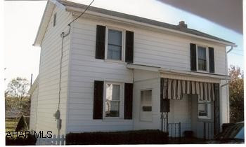 Two-story, in town, move in condition. Small fenced yard, great starter home or good investment. Home has large kitchen, full basement / walk-out, rear covered deck, front covered porch, fenced yard and newer windows.