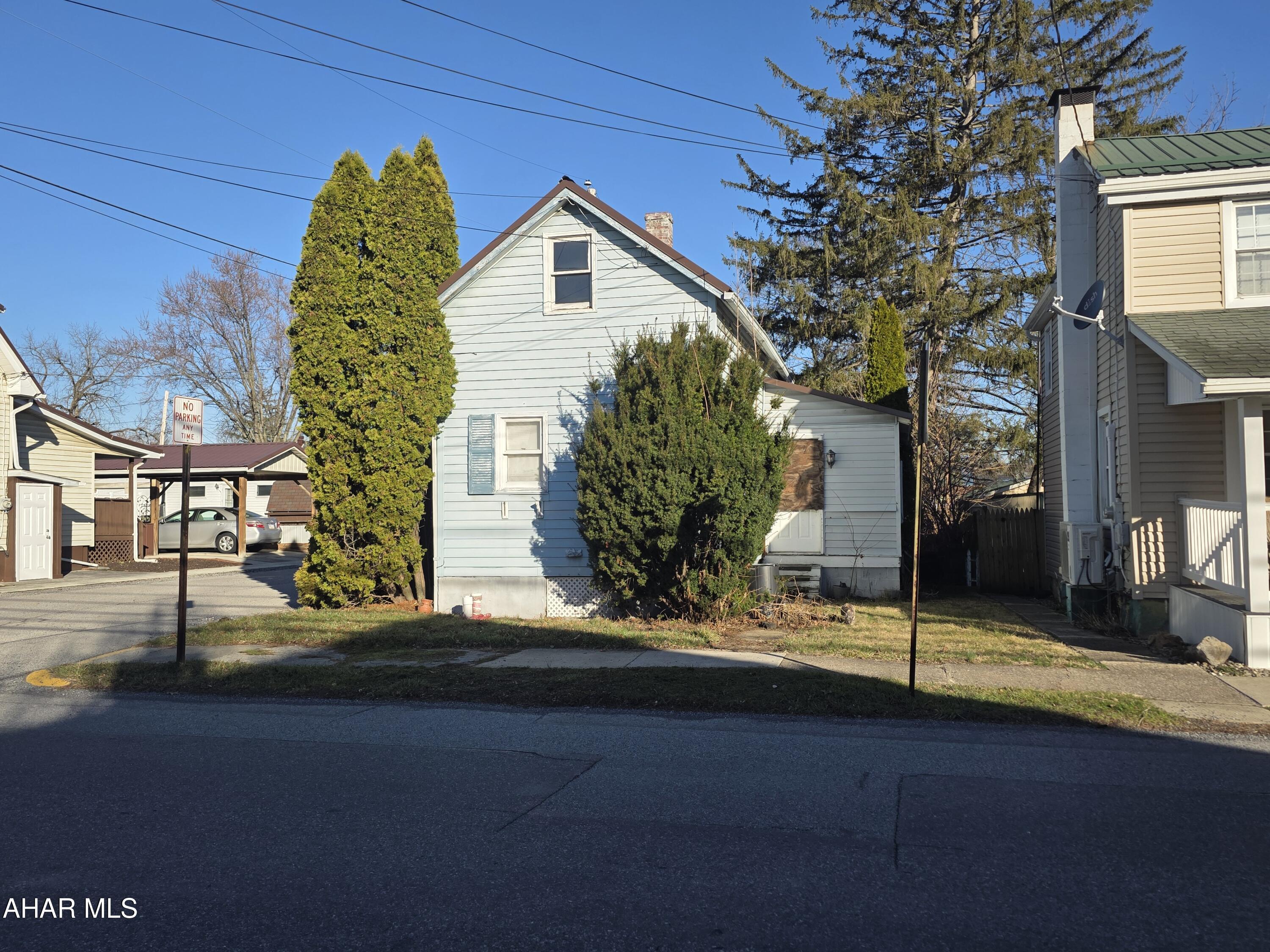 This  one-and-a-half-story home sits prominently on a corner lot, offering a fantastic footprint for someone with a vision. Featuring two bedrooms and a full bath, the interior is a blank canvas awaiting a full remodel and some much-needed TLC to restore its character. While the inside needs work, the exterior boasts a durable newer metal roof, providing peace of mind while you renovate. The outdoor space includes a fully fenced-in backyard and a convenient storage shed, making it an ideal project for an investor or a DIY-savvy buyer looking to build equity.