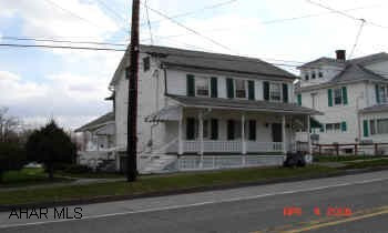 2 story Frame house Nice home, for the money, in Schellsburg Boro.  Large level lot w/off street parking, w/detached wood garage.  Pine & Alloc wood floors. Nice flow to house; kitchen laundry area.  Full unfinished basement w/walk-out.  Several rooms have been completly redone.  One bedroom is held captive (go through another bedroom to get to the other).  Two covered porches.  Dining room light & refrig. are not included.