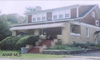 LARGE BRICK/WOOD 3 BEDROOM HOME WITH EAT-IN KITCHEN, FORMAL DINING ROOM. LOCATED BEHIND THE ALLEGRO RESTAURANT. LARGE LOT.