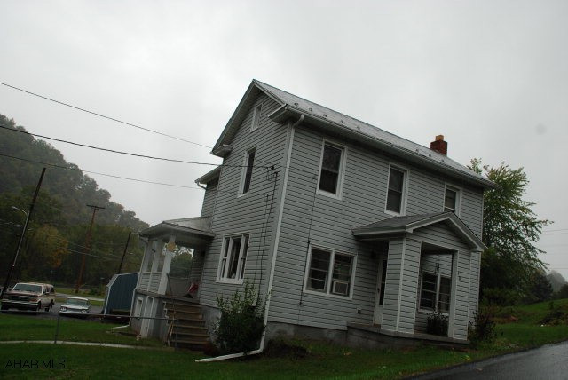 nice vinyl sided home with stone woodburning fireplace hardwood floors, 3 bedroom 1 bath, 24 x 24 2 car garage, 8 year old oil hot water furnace,vinyl replacement windows on 2 floor,near lake Raystown, and yellow creek.
