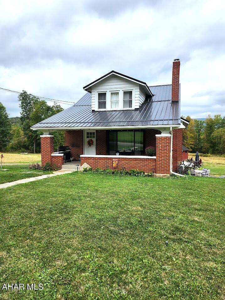 Charming 1.5-story brick home situated on 3.025 acres in a peaceful country setting just minutes from Bedford. This inviting property offers 2 spacious bedrooms and 2 full baths with a bright, open-concept layout that combines the kitchen, dining, and living areas—perfect for everyday living or entertaining.

An additional room at the top of the steps provides flexible space that could be used as a home office, guest room, or third bedroom. The full, unfinished basement provides plenty of storage and potential for future living space.

Outside, you'll find a large 40x60 barn—ideal for storage, hobbies, or small livestock—and open acreage with beautiful countryside views. Whether you're looking for a quiet retreat or a place to enjoy outdoor living, this property has it all.