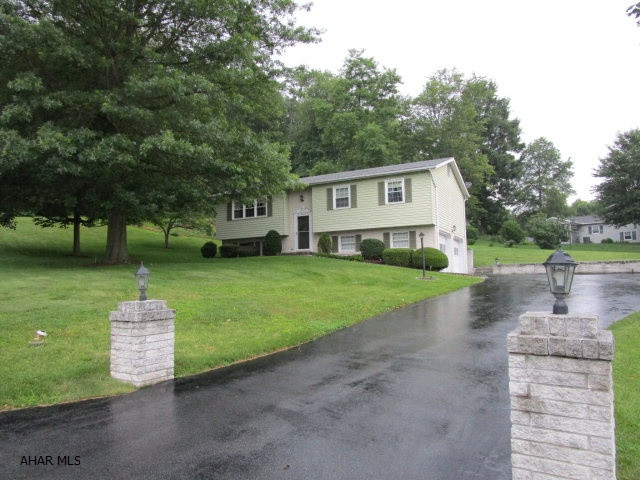 This very well maintained bi-level rests on a corner lot with a manicured lawn and professional landscaping. Super location in the borough and just a short walk to the downtown area. Main level offers a living room, kitchen with eat-in area, dining room, 3-beds and a full bathroom. Finished basement with a family room, laundry with half bath and bonus or storage room. 2-car integral garage with auto openers and a spacious blacktop driveway. True brick accent, large rear screen porch and security system. Move-in ready!!