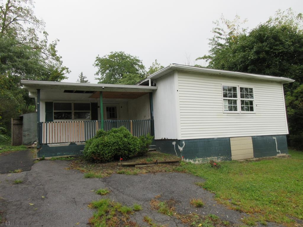 Altoona/Sugar Run area vinyl 1 story home with large 1.22 acre lot. Large home with over-sized detached garage, but needs work throughout. Perfect for handy persons. Property sold AS-IS. Seller will make no repairs. Offers must be submitted through HUD approved broker. Buyer pays both transfer taxes. Exclusive Agency. Equal Housing Opportunity.