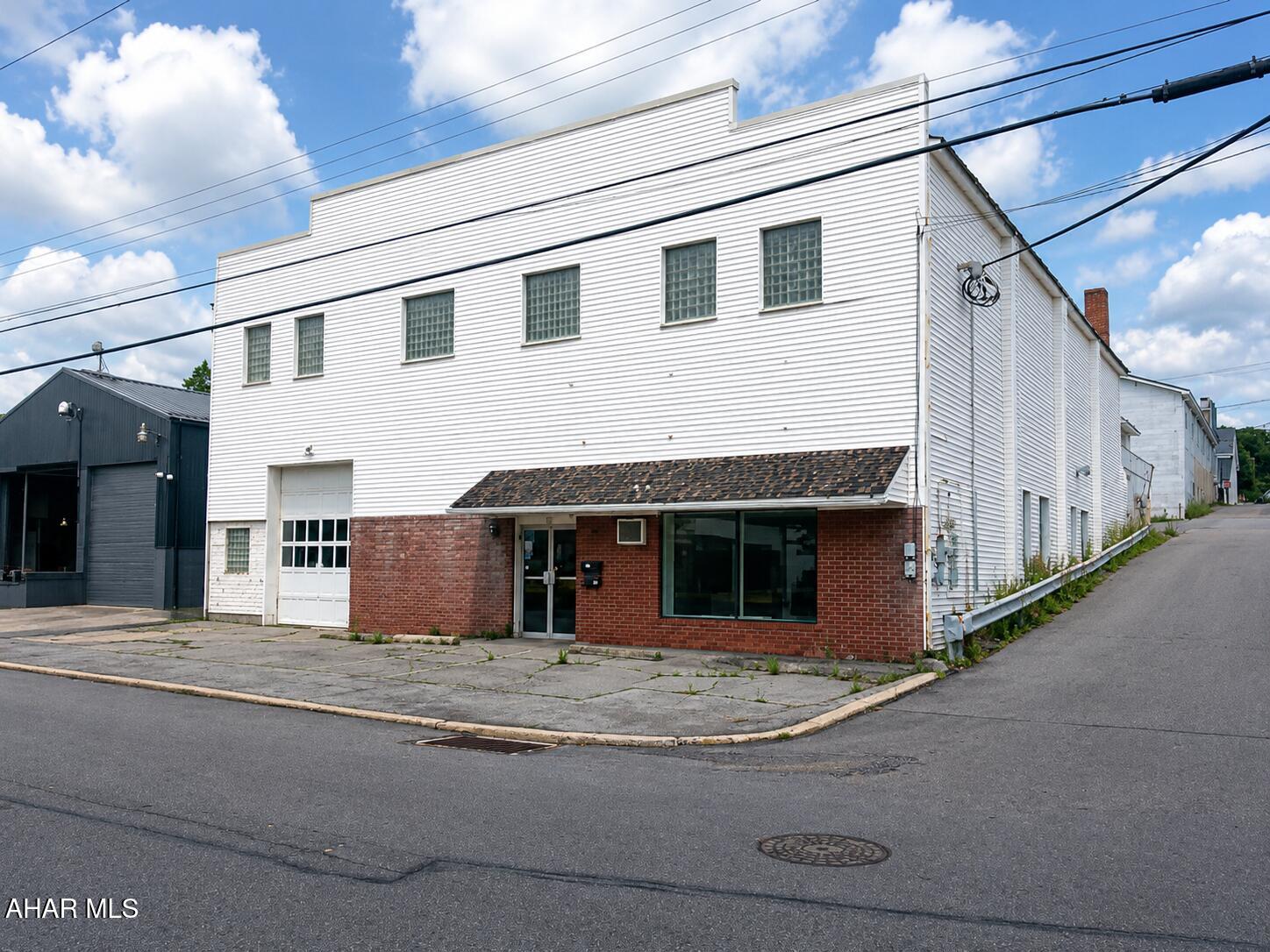 Discover the possibilities with this versatile commercial space offering approximately 4,000 square feet of usable area. The property features two private offices, 3-phase electric service, high ceilings, and a large overhead garage door, making it well suited for industrial operations, contractors, skilled trades, warehousing, light manufacturing, or equipment storage. Large display windows provide excellent visibility and create an attractive showroom opportunity for businesses seeking both functionality and customer exposure.

The property's flexible layout has successfully accommodated a variety of businesses over the years, including a carpet supply company, an equipment rental operation, and most recently a brewery. Off-street parking adds convenience for employees and customers alike. Whether you're looking to expand an existing business, establish a showroom, or create a customized workspace, this property offers the adaptability to support a wide range of commercial uses.

Contact us today for additional information or to schedule a private showing.