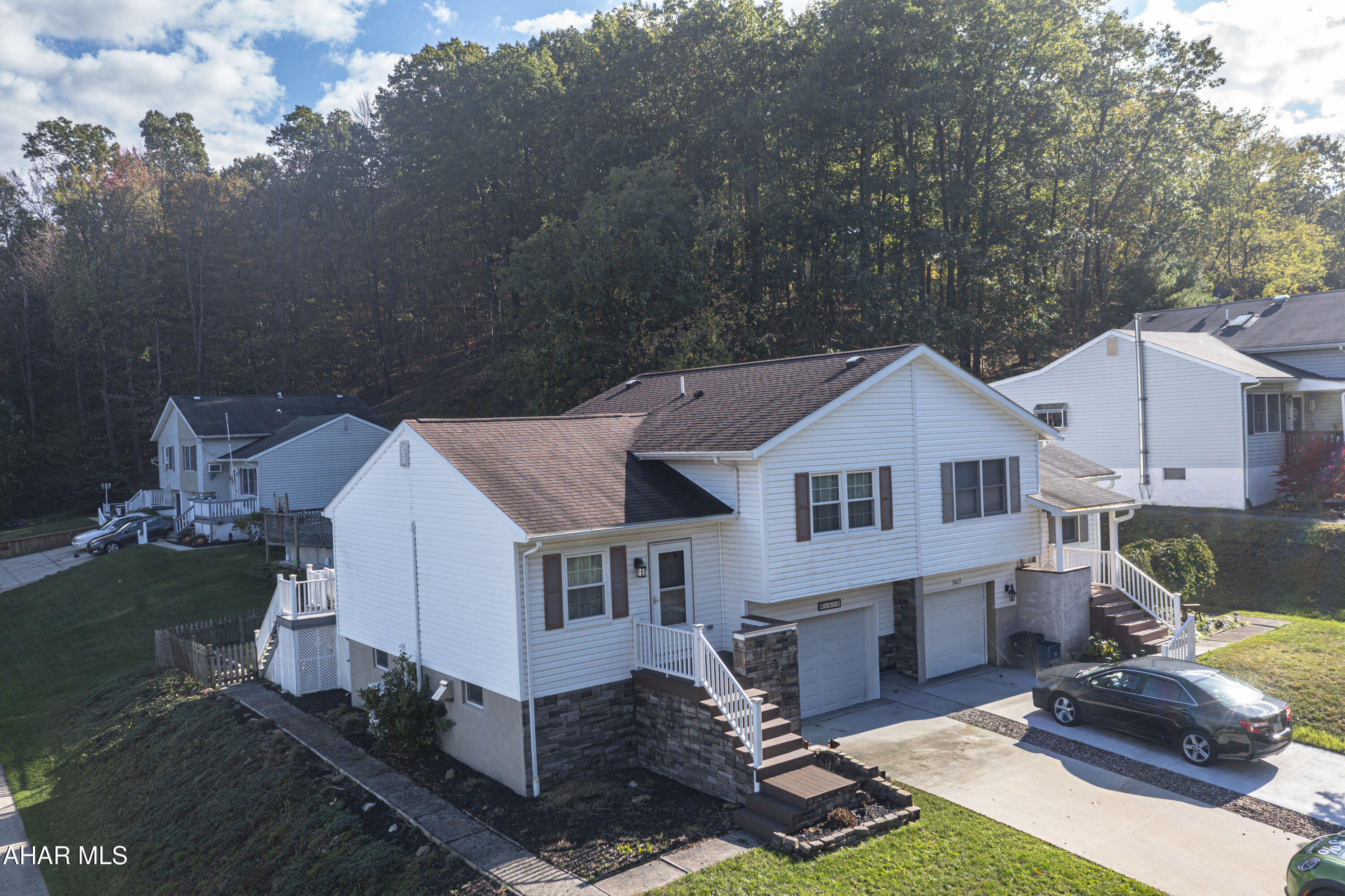 Welcome to this beautifully maintained 2-bedroom, 1-bathroom modern townhouse located on a quiet dead-end road in Altoona, PA. This home is ideal for first-time buyers, a starter-home, or for savvy investors seeking a reliable rental property.

Walk up the Trex decking entry into the home, greeted with vaulted ceilings in the living room. The home features: plenty of storage with the basement, opportunity to finish the basement, hook-ups in the laundry room where a 2nd bathroom could be added. The home boasts an attached garage and ample off-street parking, making daily life convenient and stress-free.

Enjoy entertaining or relaxing on the spacious Trex deck, overlooking a fenced-in backyard - perfect for pets, kids, or private outdoor gatherings.

Located just minutes from Ebner Elementary School and Leopold Park, this home blends comfort, convenience, and community with the privacy you've been looking for. Whether you're starting your homeownership journey or adding to your investment portfolio, this property is a must-see.

Schedule your showing today - your next chapter starts here at 1619 Timberline Drive!