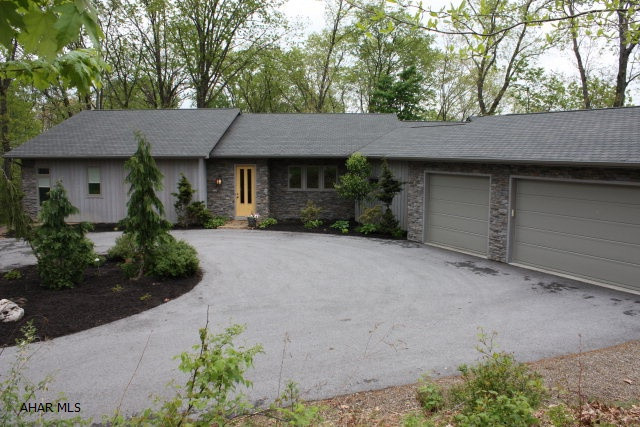 EXTREME PRICE REDUCTION!! Spectacular custom-built cedar/stone contemporary home at the end of a quiet cul-de-sac in Fox Hollow. This 5 BR, 3.5 bath home features solid cherry cabinetry, soapstone & zinc countertops along w/Jenn-Aire appliances in the kitchen.  Adjacent to the kitchen is a magnificent great room with a massive stone FP which opens to the formal DR.  Other features include an inviting master suite w/bamboo flrs, master bath w/jacuzzi tub, double vanity, separate tiled shower & walk-in closet. In addition, there is a library/office, a guest room & 1/2 bath. At the other end of this 4,000 sq.ft. home is another great room, 3 additional BR's & 2 full baths. Let's not forget about the 3-car garage w/plaster walls, built-in storage, radiant heated flrs & attic storage.