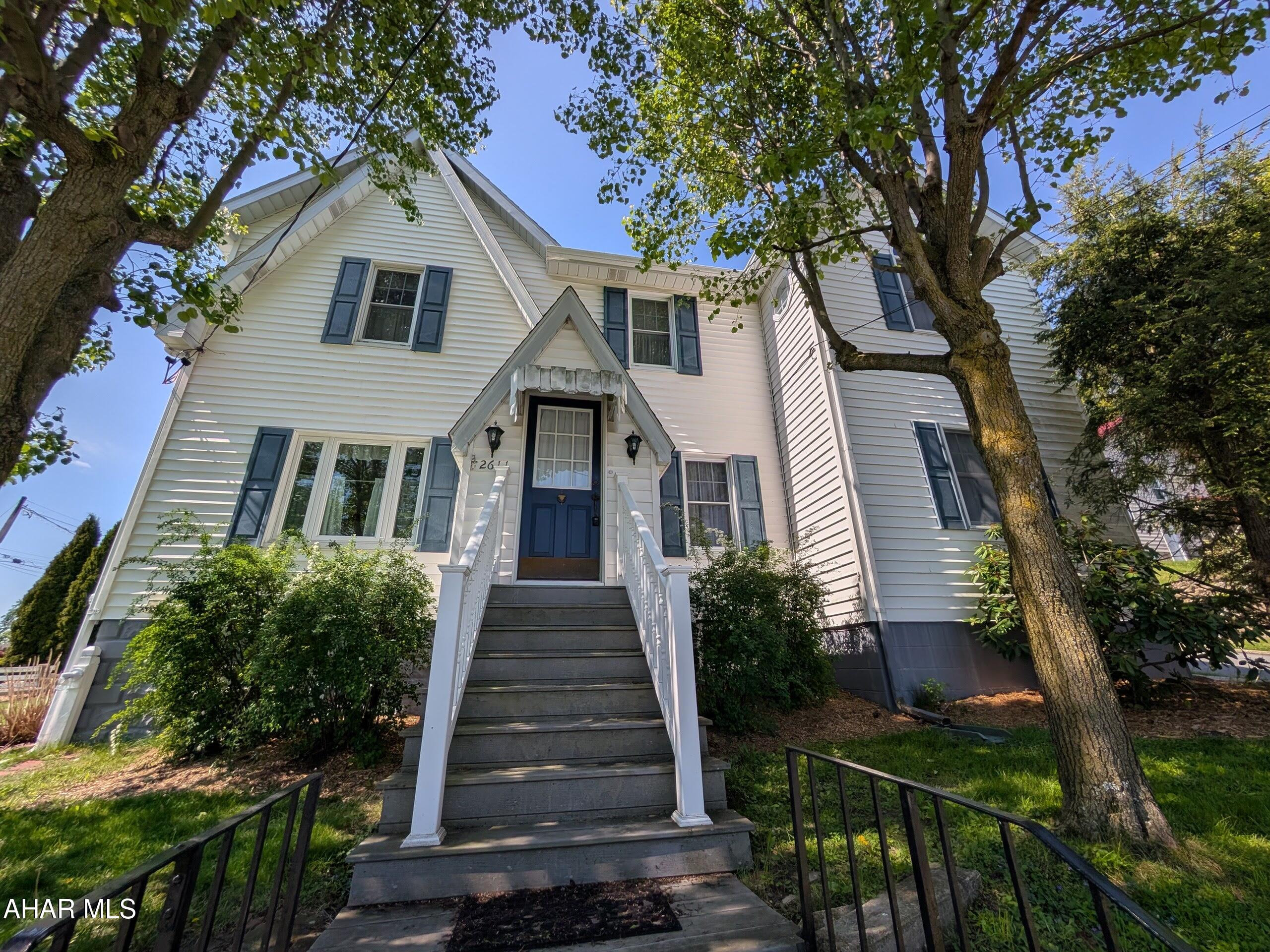 Discover spacious living and timeless charm in this beautifully maintained Fairview home. The main level features a formal living room with built-in shelving, a dining room with a classic corner hutch, and a massive family room anchored by a gas fireplace. The kitchen is a chef's delight, boasting hickory cabinets, solid surface countertops, a tile backsplash, and a unique built-in antique Hoosier. Upstairs, you'll find three bedrooms and two updated baths, including a primary suite with vaulted ceilings and a versatile adjoining dressing room or office. The exterior offers a level, professionally landscaped yard with a sitting bench and storage shed. Major updates provide ultimate peace of mind, including a furnace and central air system installed in 2023, along with a professional basement waterproofing system featuring a transferable warranty. Combining character with modern mechanicals, this home is a must-see!