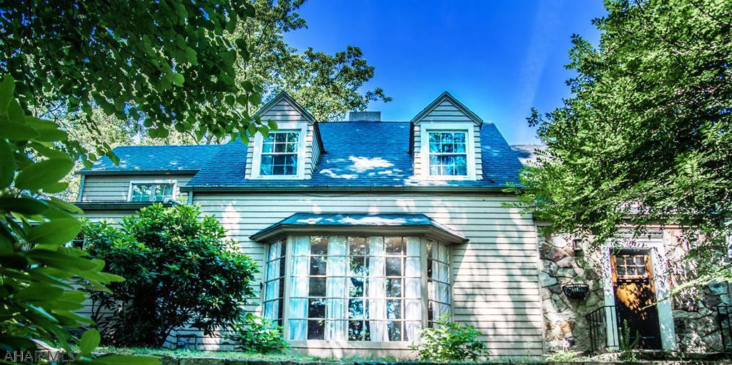 Well, Well, Well!  Well located, well built, & well maintained...that is what you have with this Ridge Avenue home.  Impress your quests in the spacious living room with brick fireplace, Bose surround sound, built in bookcases.  The tastefully designed kitchen is exceptional with a granite island, ceramic tile floor, & instant hot water heat.  Gorgeous Master Bathroom.  Entertain on the large, inviting deck.  The home also has Central Air, finished basement with fireplace, heated garage.  Check out the Virtual Tour that really shows how impressive this home is. Sellers to give a $2,000. flooring allowance at closing.