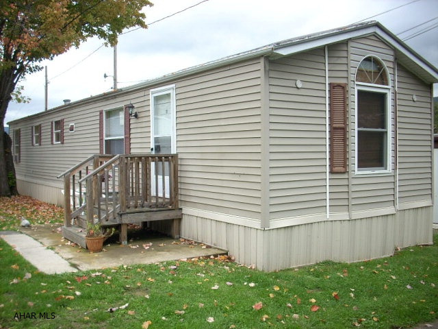 Mobile Home Park; rented lot $290.00 pr/month.  Includes water, sewer, lawn & snow; (55 years and older living community).  Application must be approved by Mobile Home Park!  Hot water tank 3 years old, furnace 3 years old.  New floor coverings (carpet and vinyl).