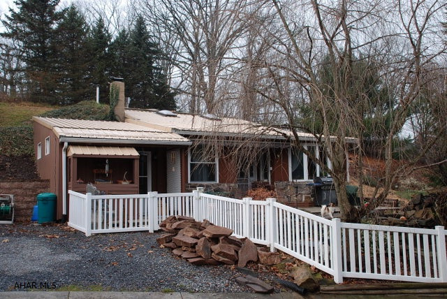 unique property. House is built partially underground. pond and a barn. stone fireplace with pellet stove insert.