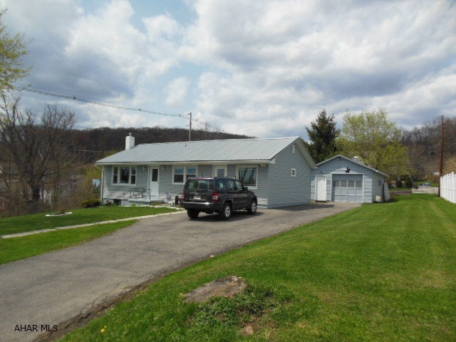 Very neat/updated ranch home on a large corner large 100x120 lot with a garage, shed, large basement and more! A metal roof, new bath, windows, living room, doors, siding, spouting, flooring, counter-top, sink, etc. Appliances include stove, 2 refrigerators, washer & dryer to get you up and running in no time. Quieter area. Nice homes surrounding this. Easy living! Easy to make handicap accessible.