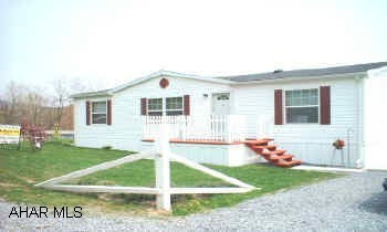 Beautiful 2002 28x44 Dbl Wide, extremely well maintained & well positioned large landscaped corner lot.   2 porches plus rear deck. 12x12 shed w/electric. Home is wired for Dish TV. Rented lot $245.00 includes trash remova and road maintenancel. Very low heating costs.  Furnace set up for central air.   Great view of mountains from deck.  Motivated Seller!