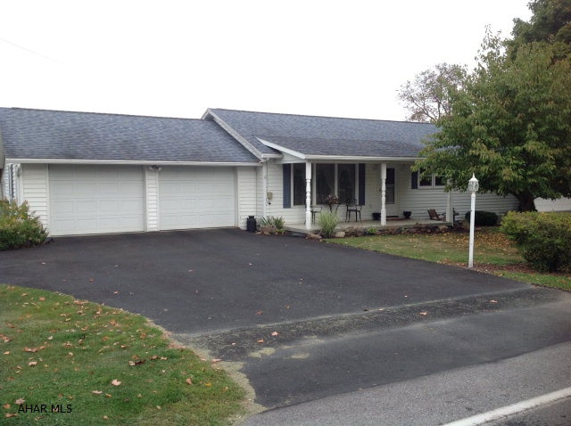 MOVE IN READY RANCH WITH A FENCED IN YARD AND STORAGE SHED IN THE COUNTRY BUT YET JUST MINUTES FROM TOWN. COMPLETE FINSHED BASEMENT WITH  SPACIOUS ROOMS THROUGH OUT.   BASEMENT HAS WALK OUT ENTRY AND WOODBURNER.  ENCLOSED SUNROOM.