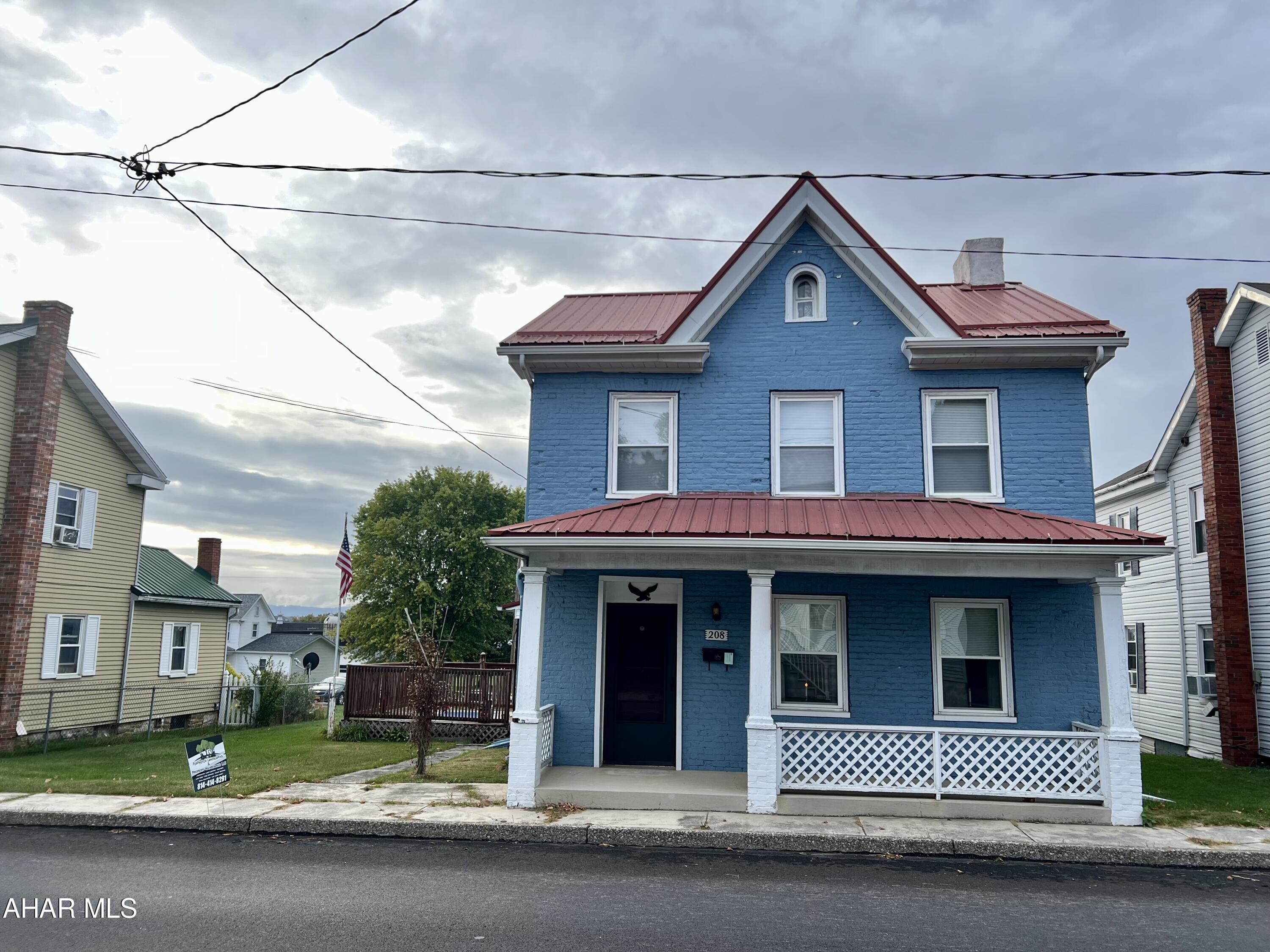 Charming home in Martinsburg, Pa features a spacious kitchen with a large pantry, a dining area and large living room. The main floor includes a convenient half bath and laundry room.  Second level there are three-bedrooms and a large full bathroom. There is a 4th room on the second level that could be an additional bedroom. Currently has no direct heat Source Outside, you'll find a flat fenced in yard with a deck, perfect for entertaining. The property also offers off-street parking and a two-car garage. The metal roof was installed in 2010, and the windows were replaced in 2006.